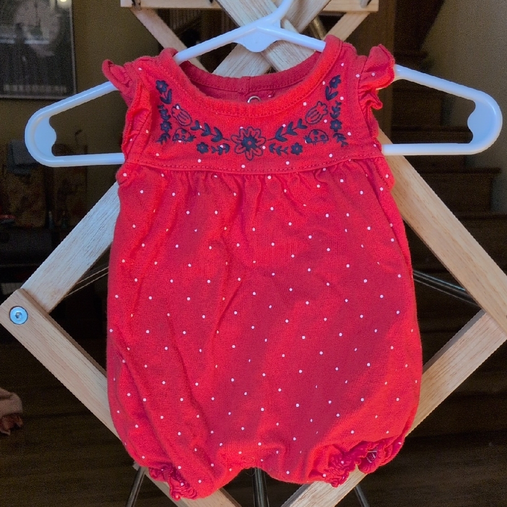 Newborn onesie with floral accents